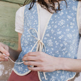 R: INEZ reversible bow tie linen vest (Size: M/L; Color: Sage Blossom // Natural/White Gingham)